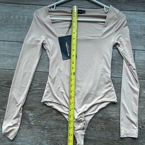 Bone second skin -square neck bodysuit with thong snap closure. Flattering fit.